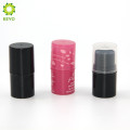 empty cosmetic round pink black colored plastic lip balm tube